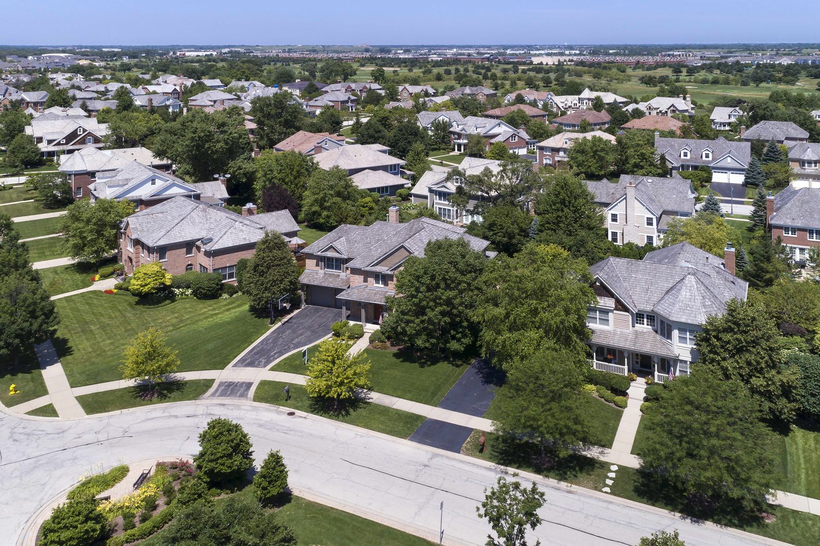 Aerial view of single-family homes on a suburban street in the Chicago area